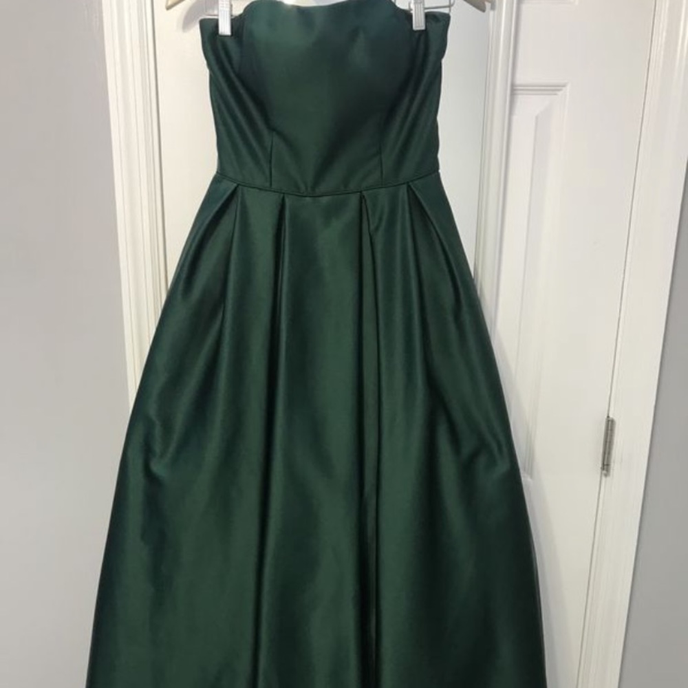 Betsy & Adam Emerald Green Strapless high low ball gown with pockets